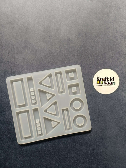 Rectangular 14-cavity jewelry casting mould with geometric cavity shapes, white