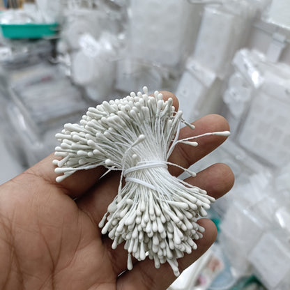 Artificial pollen bunch with white bristle flowers tied with white string