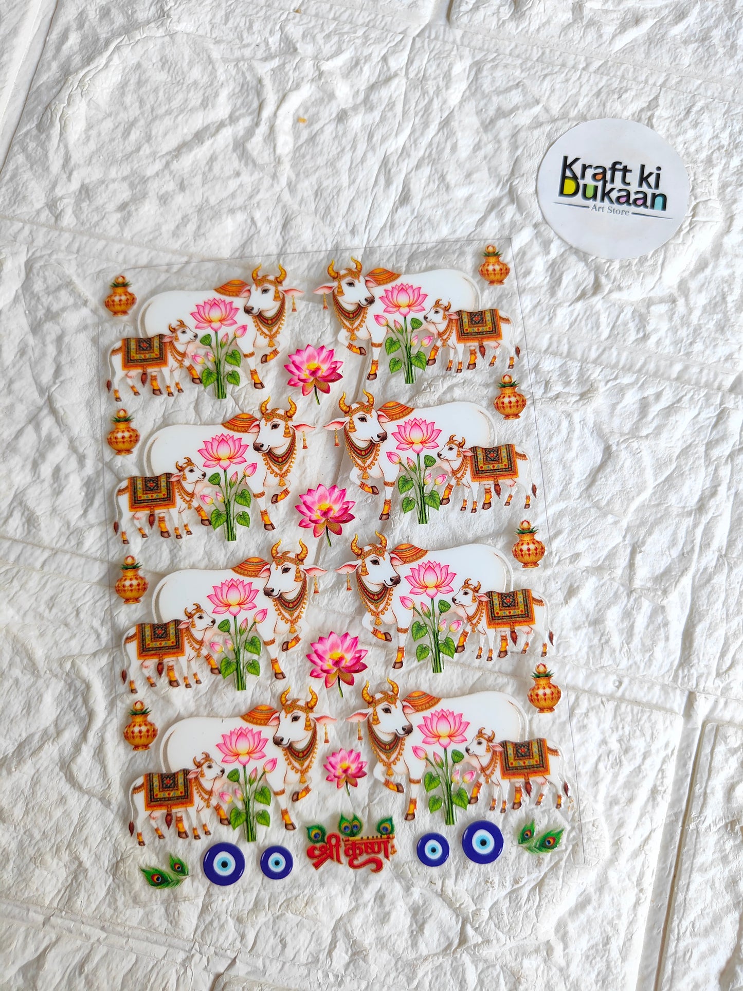 UV DTF peel-off sticker sheet with cartoon faces, pink flowers, and orange decorative motifs
