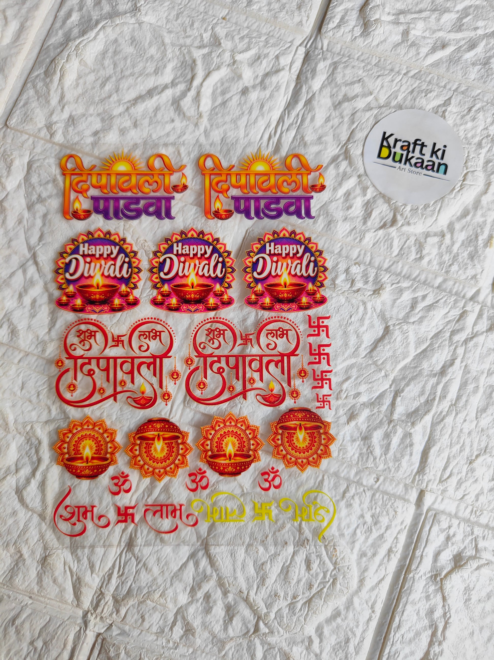 Peel-off sticker sheet with orange/red Happy Diwali text and diya icons