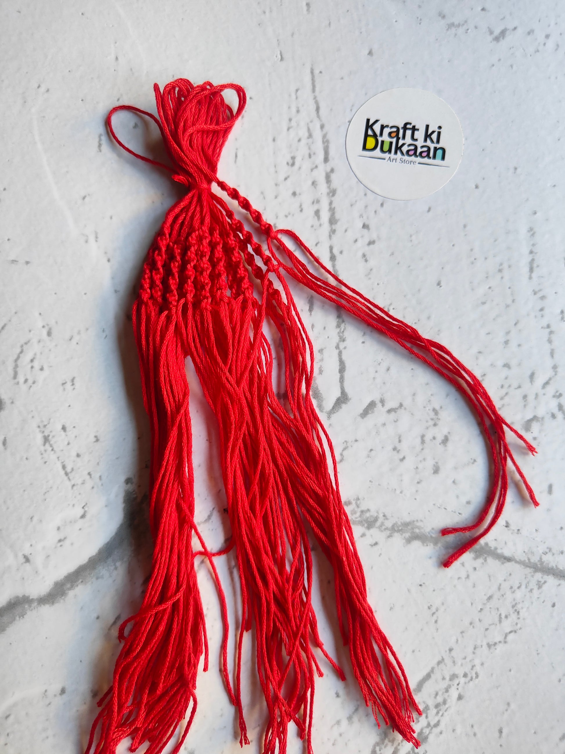 Red rakhi dori thread pack with multiple braided strands