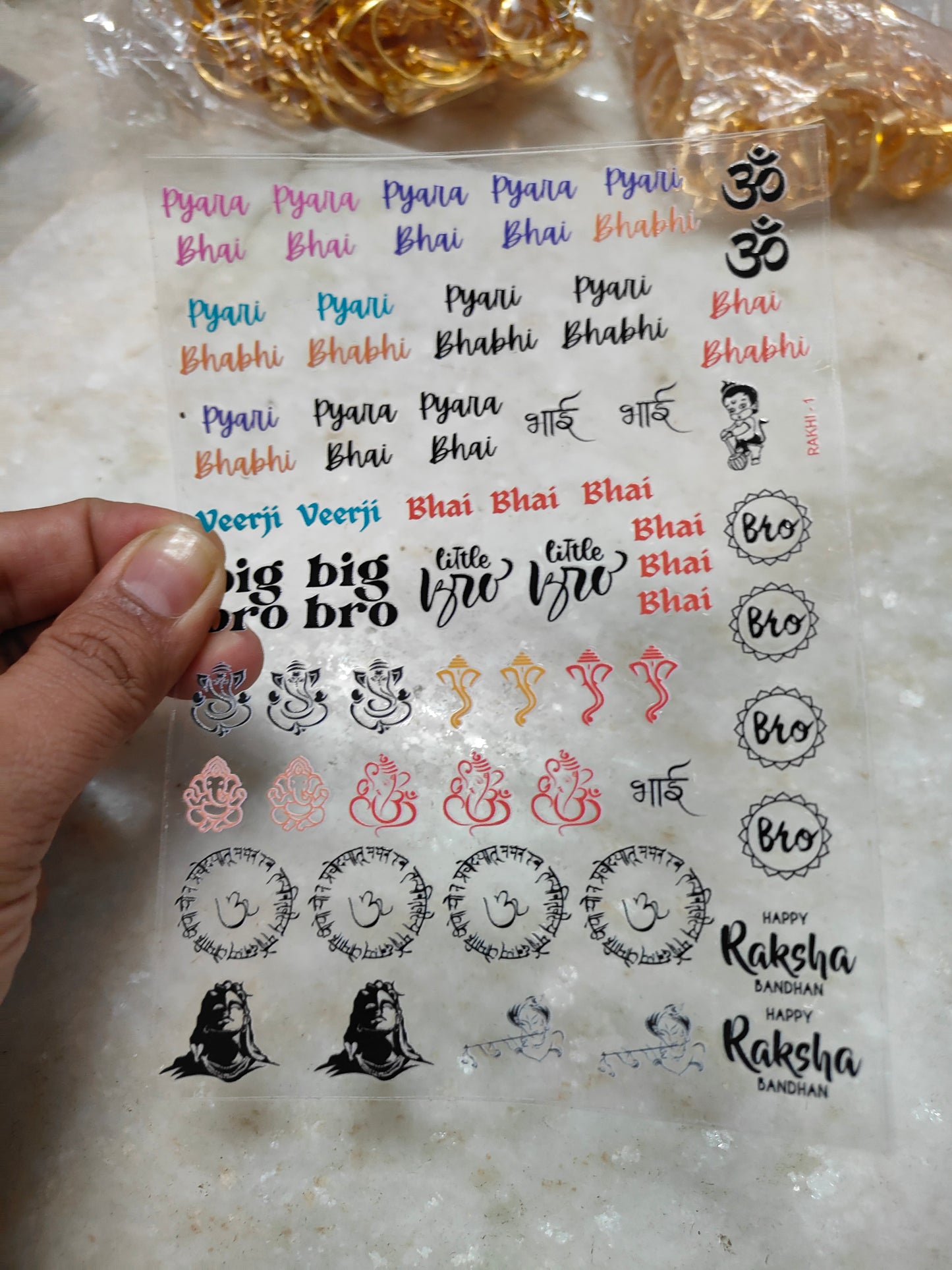 Peel-off sticker sheet with multicolor text and small decorative icons