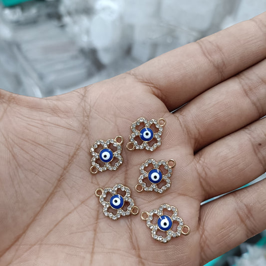 Five evil-eye heart pendants: blue enamel, rhinestone trim, gold loops