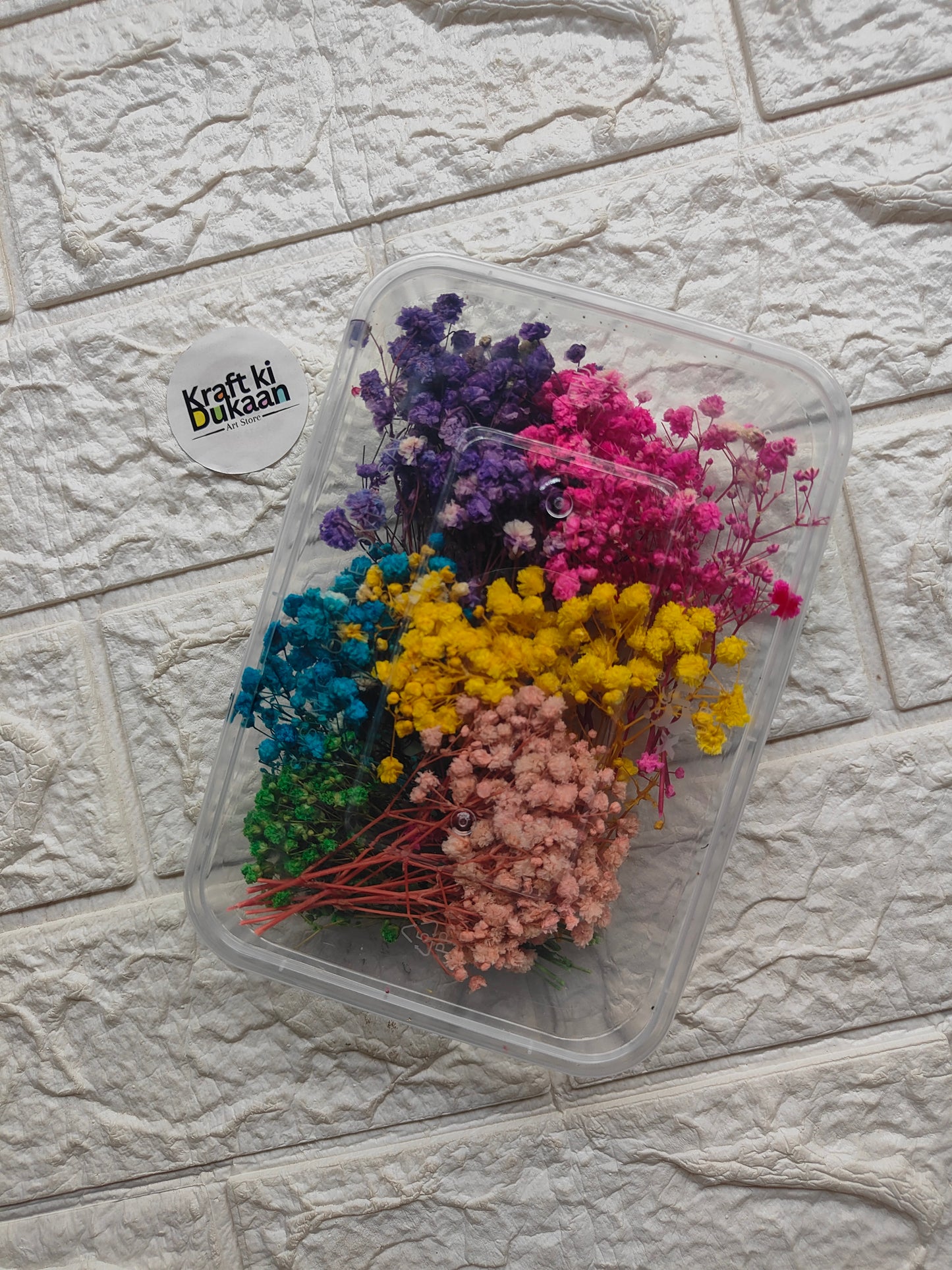 Clear plastic flower box with mixed dried flowers in purple, pink, blue, yellow, peach