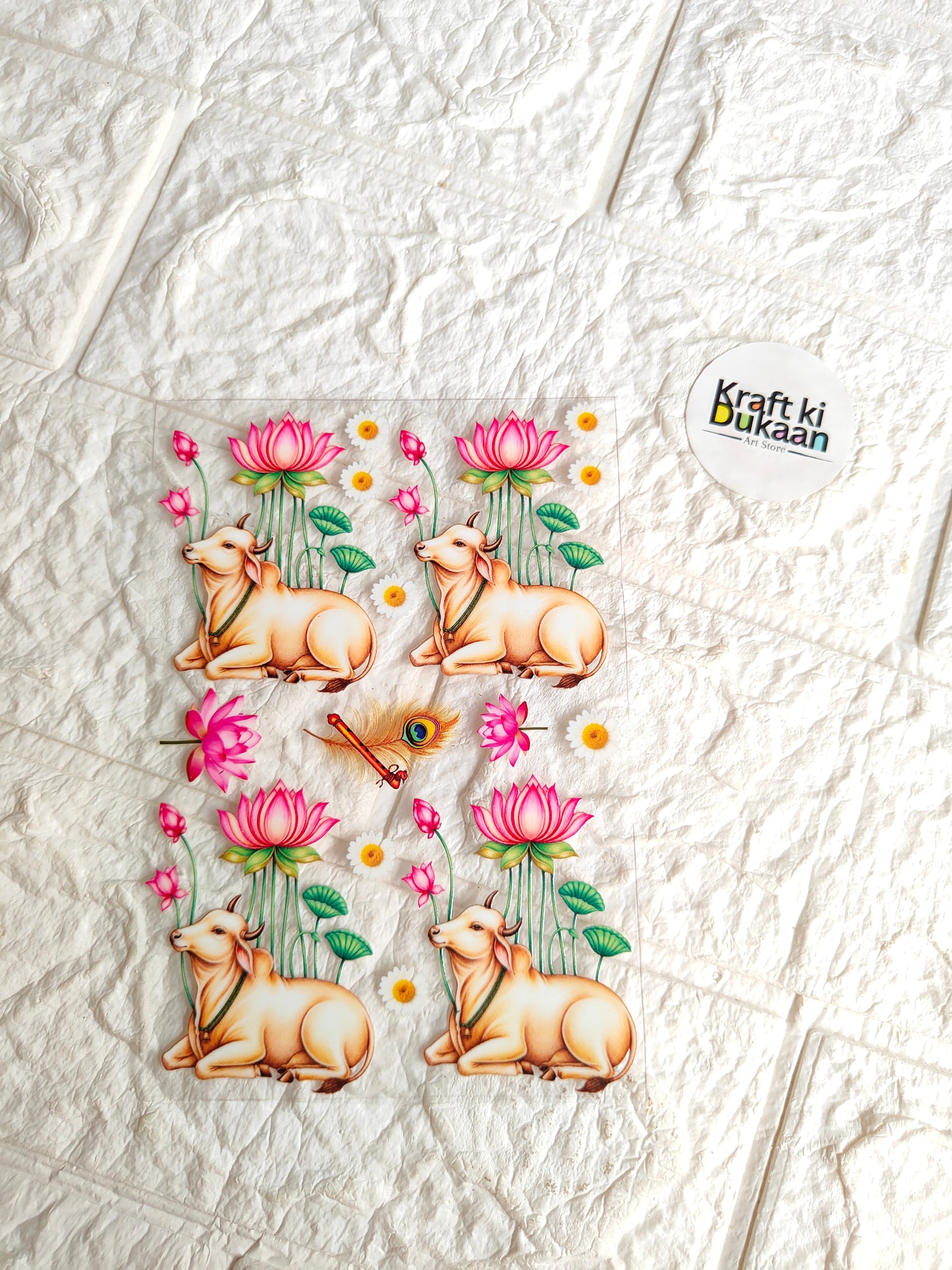 Peel-off sticker sheet with four cartoon deer, pink flowers and teal leaves