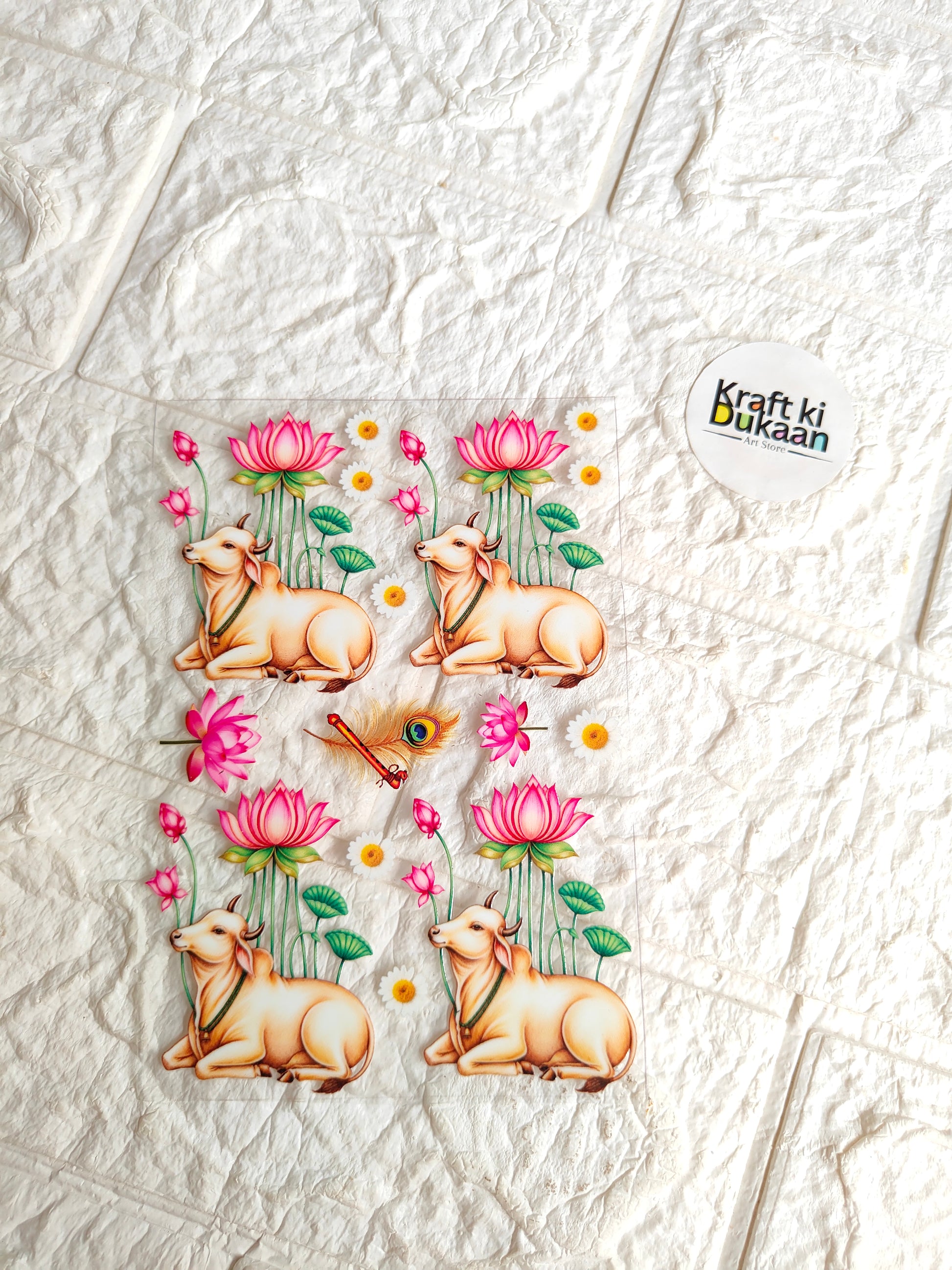 Peel-off sticker sheet with four cartoon deer, pink flowers and teal leaves
