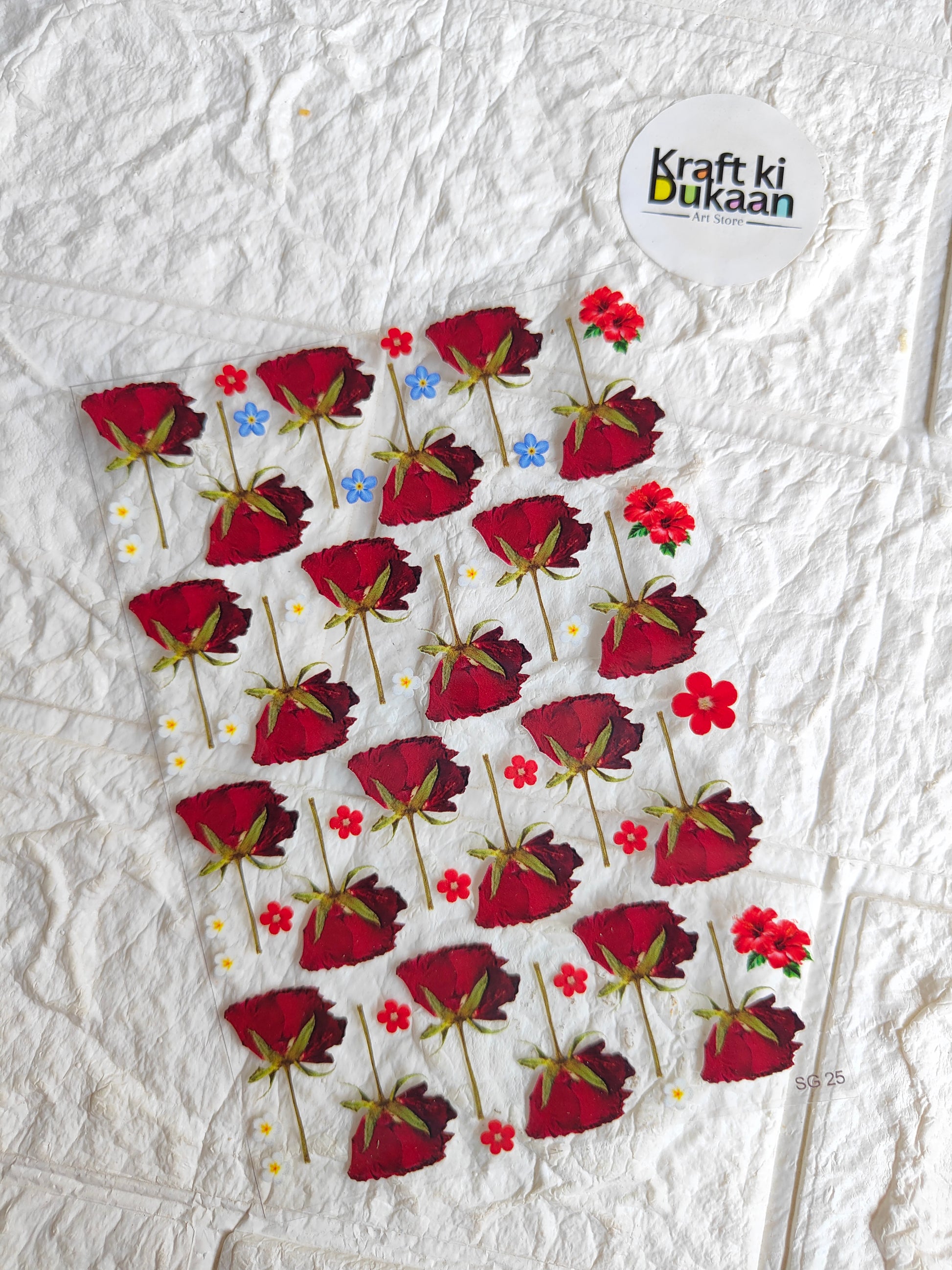 UV DTF peel-off sticker sheet with red flower designs and small blue accents
