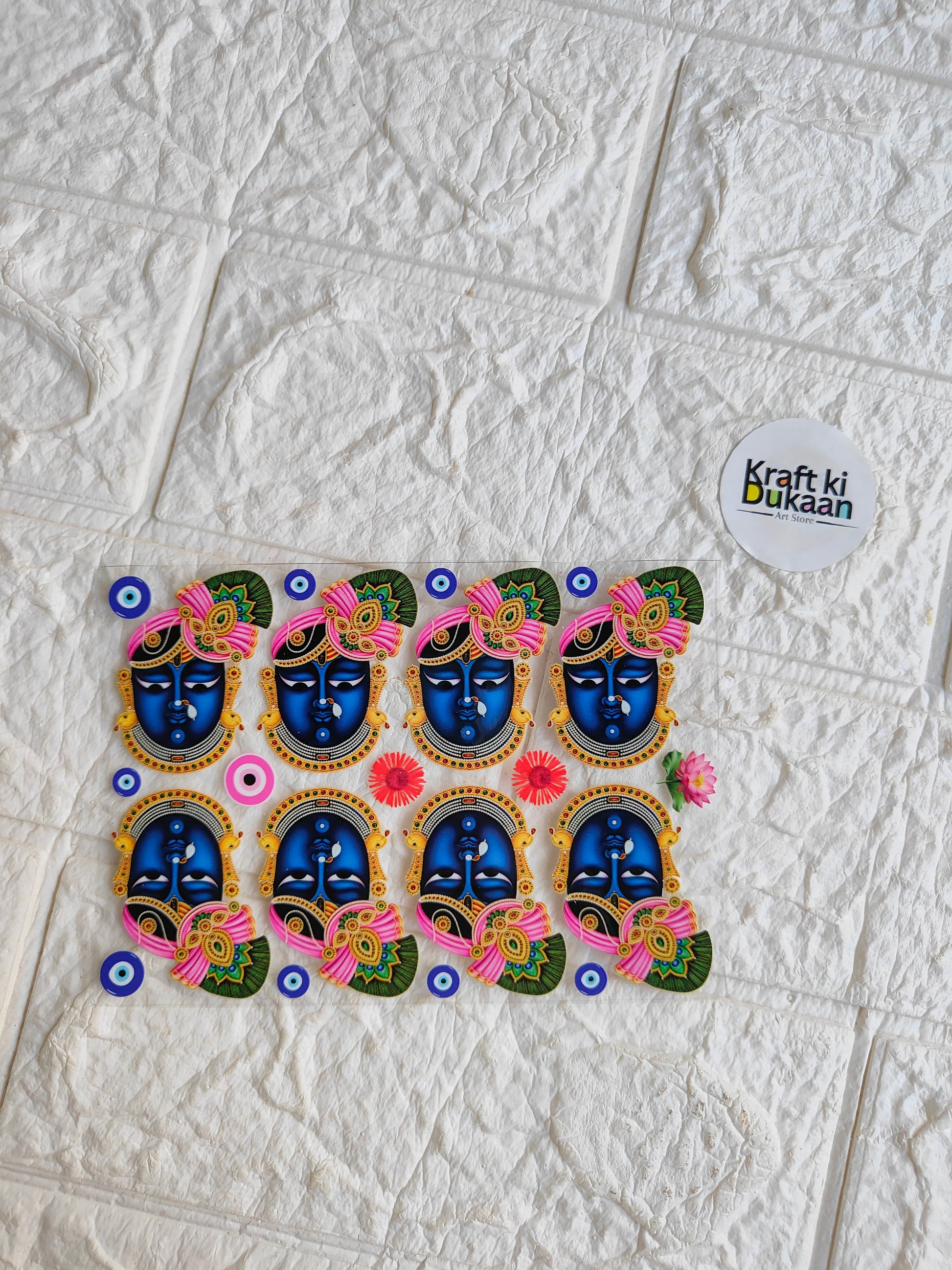 Peel-off sticker sheet with eight colorful ornate face designs