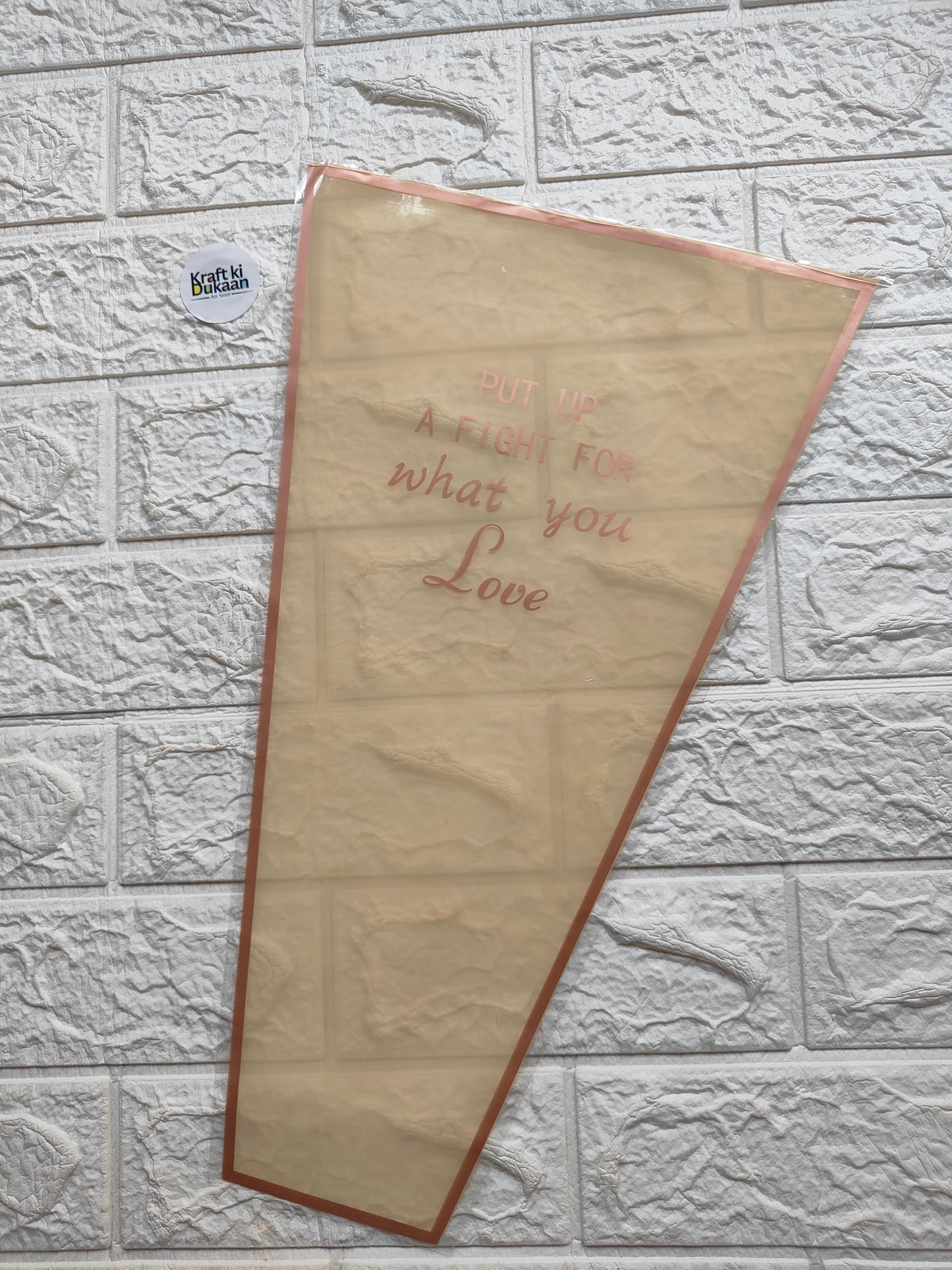 Bouquet cover sleeve in light beige with orange border and “Love” text