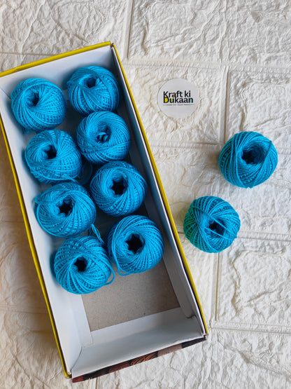 Rakhi thread spool set in bright blue, open box with multiple spools and extra spool