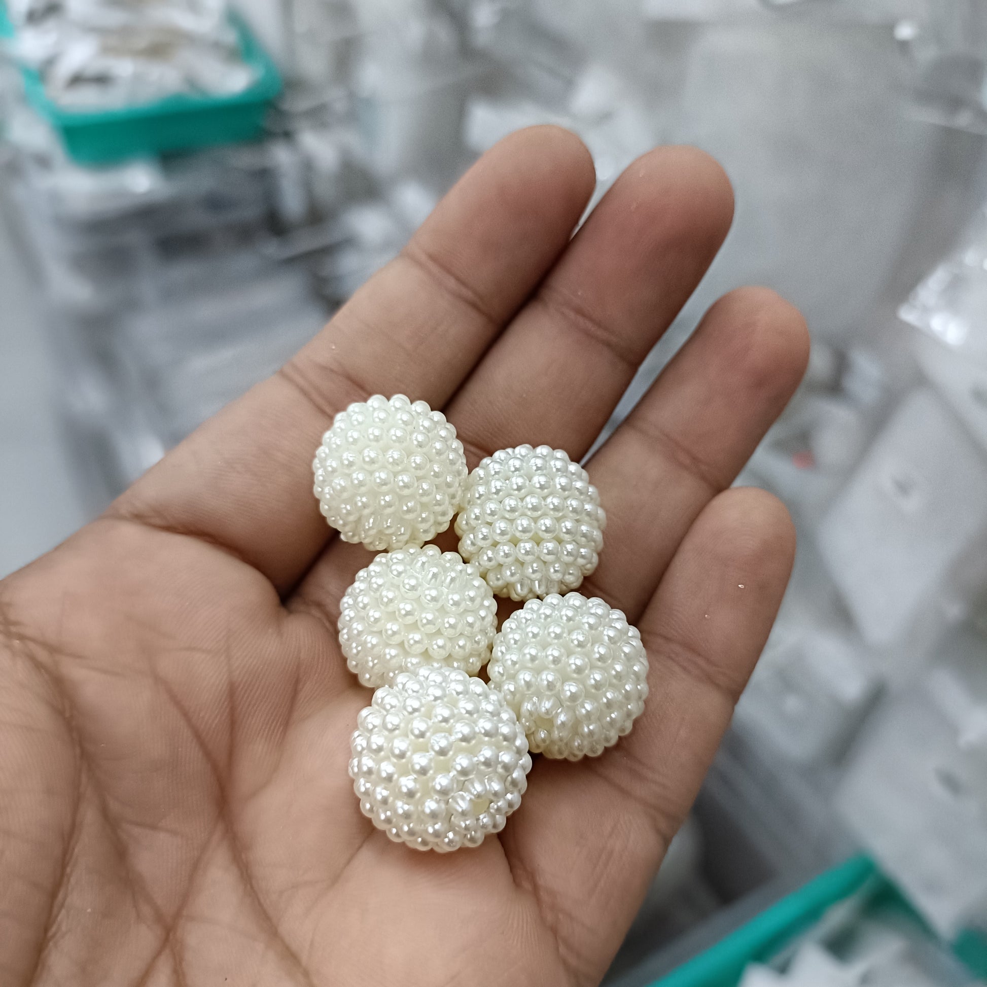 White pearl ball beads (20mm), multiple beads shown in hand