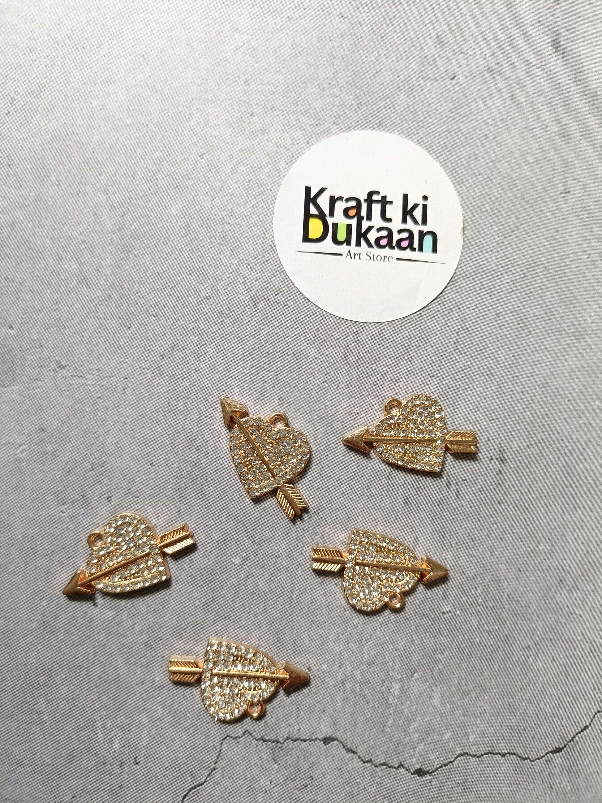 Set of five gold-tone rhinestone heart-shaped pendant charms with loop bails