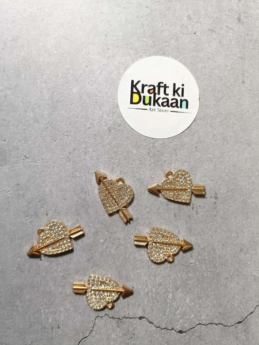 Set of five gold-tone rhinestone heart-shaped pendant charms with loop bails