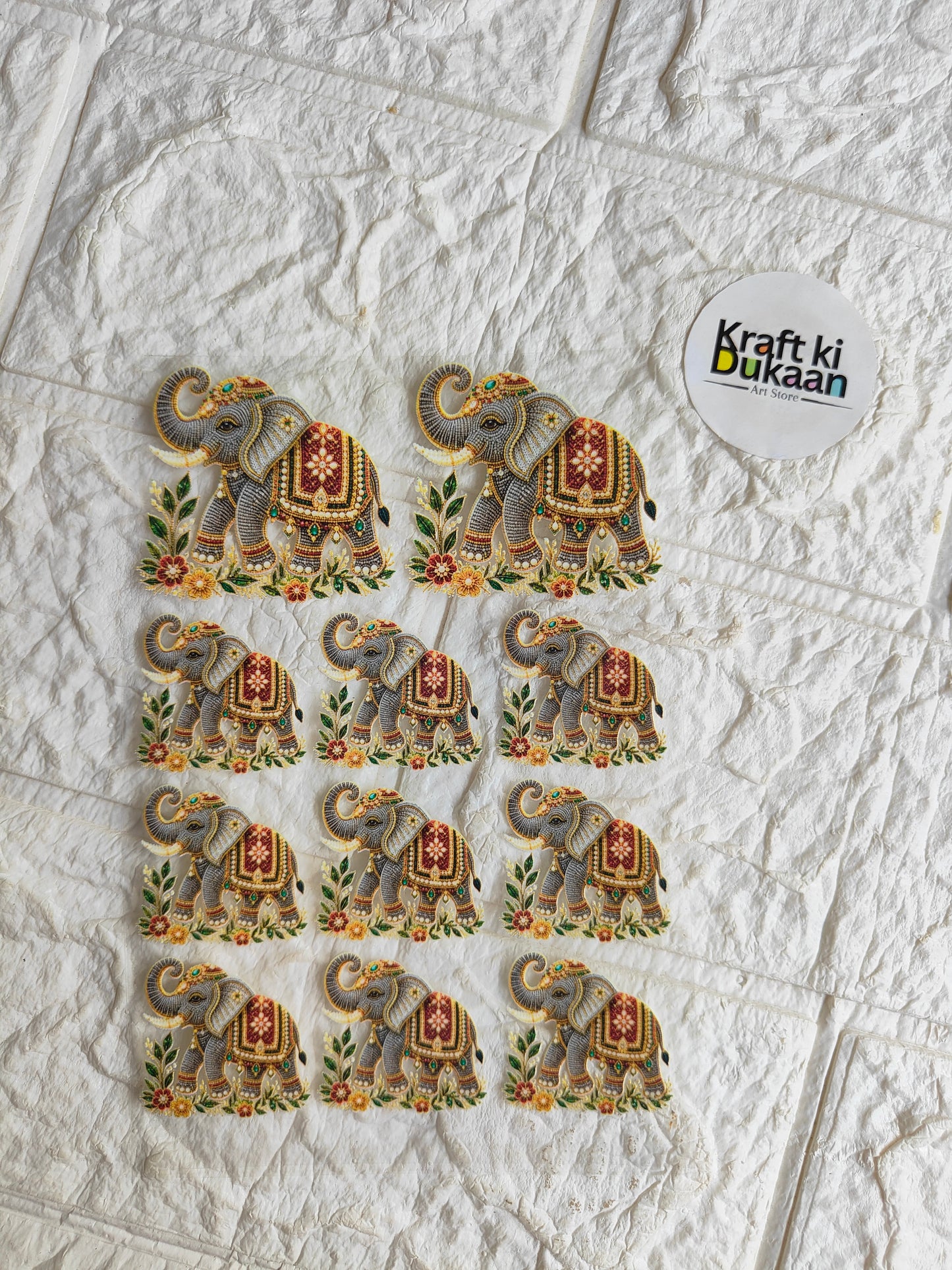Peel-off sticker sheet with multiple elephant motif stickers and Kraft ki Dukan label