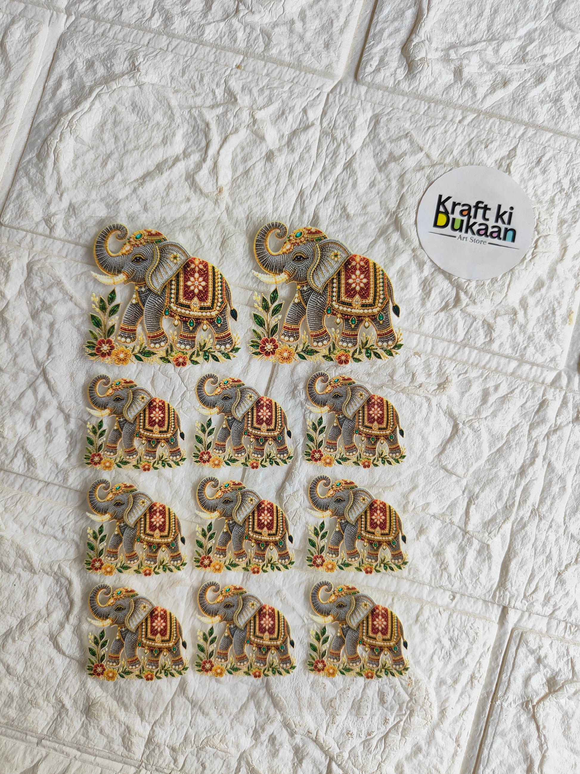 Peel-off sticker sheet with multiple elephant motif stickers and Kraft ki Dukan label