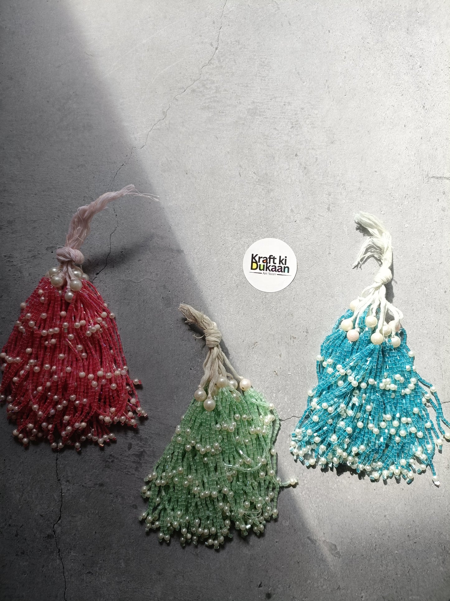 Beaded latkan set with red, green, and blue tassel charms