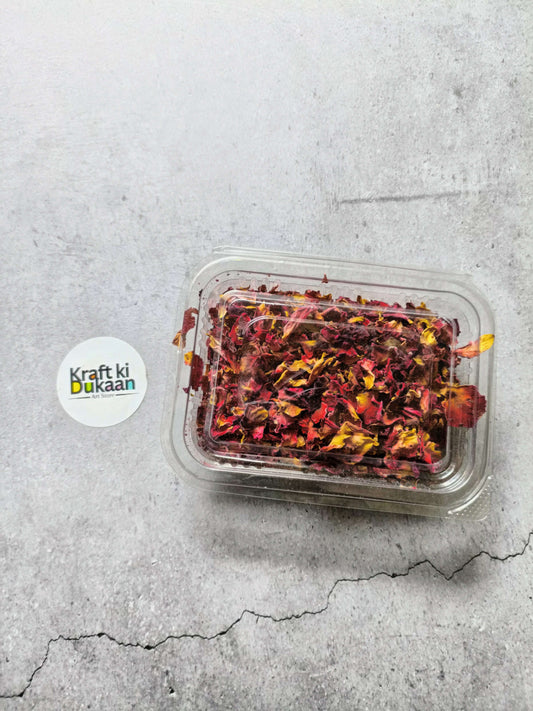 Clear plastic container of dried rose petals with snap lid