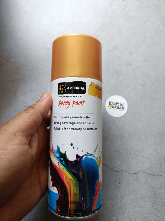 Golden spray paint can with colorful splatter artwork and “Kraft ki Dukaan” sticker