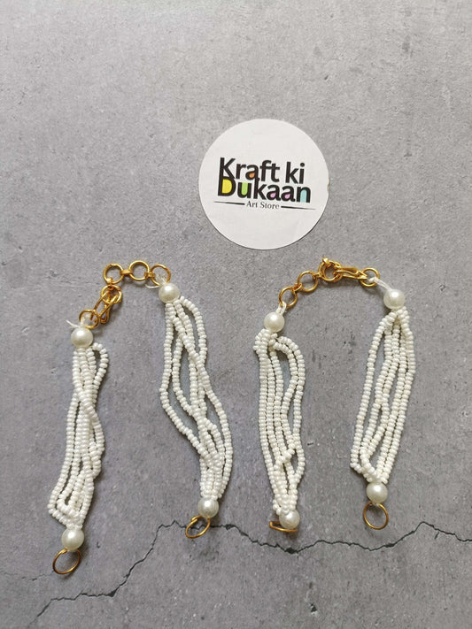 Gold link beaded bracelet with white pearl tassels and clasp rings, set of 5