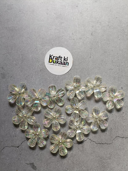 Rainbow flower beads pack laid out, clear iridescent 5-petal flower beads