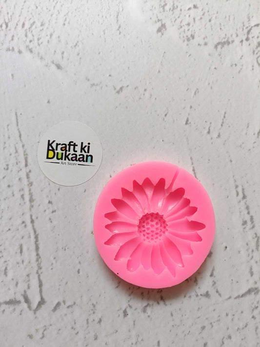 Pink Flower Mould: pink circular daisy-style silicone mold with raised petals