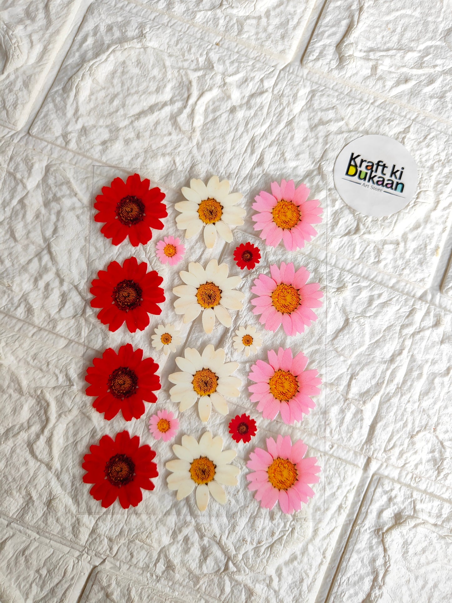 Peel-off sticker sheet with red, pink, and yellow daisy flower designs