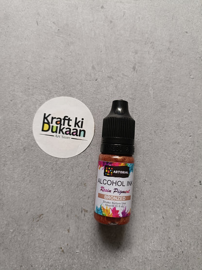 Alcohol ink bottle with black cap, bronzed resin pigment label