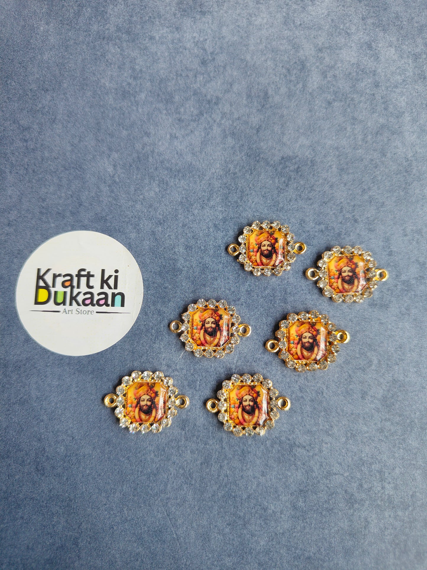 Rakhi bracelet pendants, six gold-tone circular deity medallions, ornate beaded frames