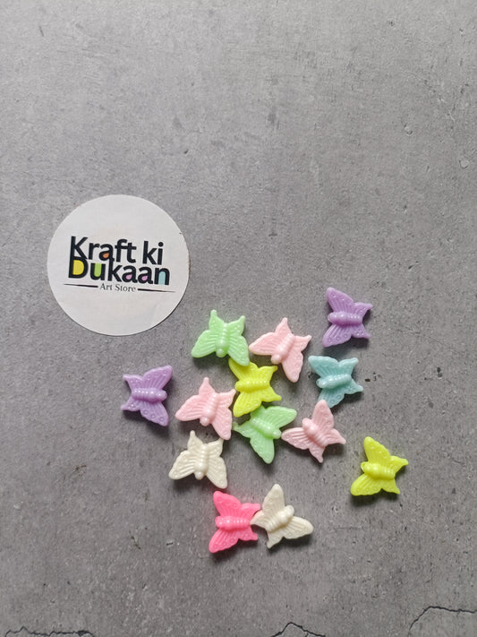 Butterfly bead charms for rakhi bracelet, multicolor set of 25, scattered view