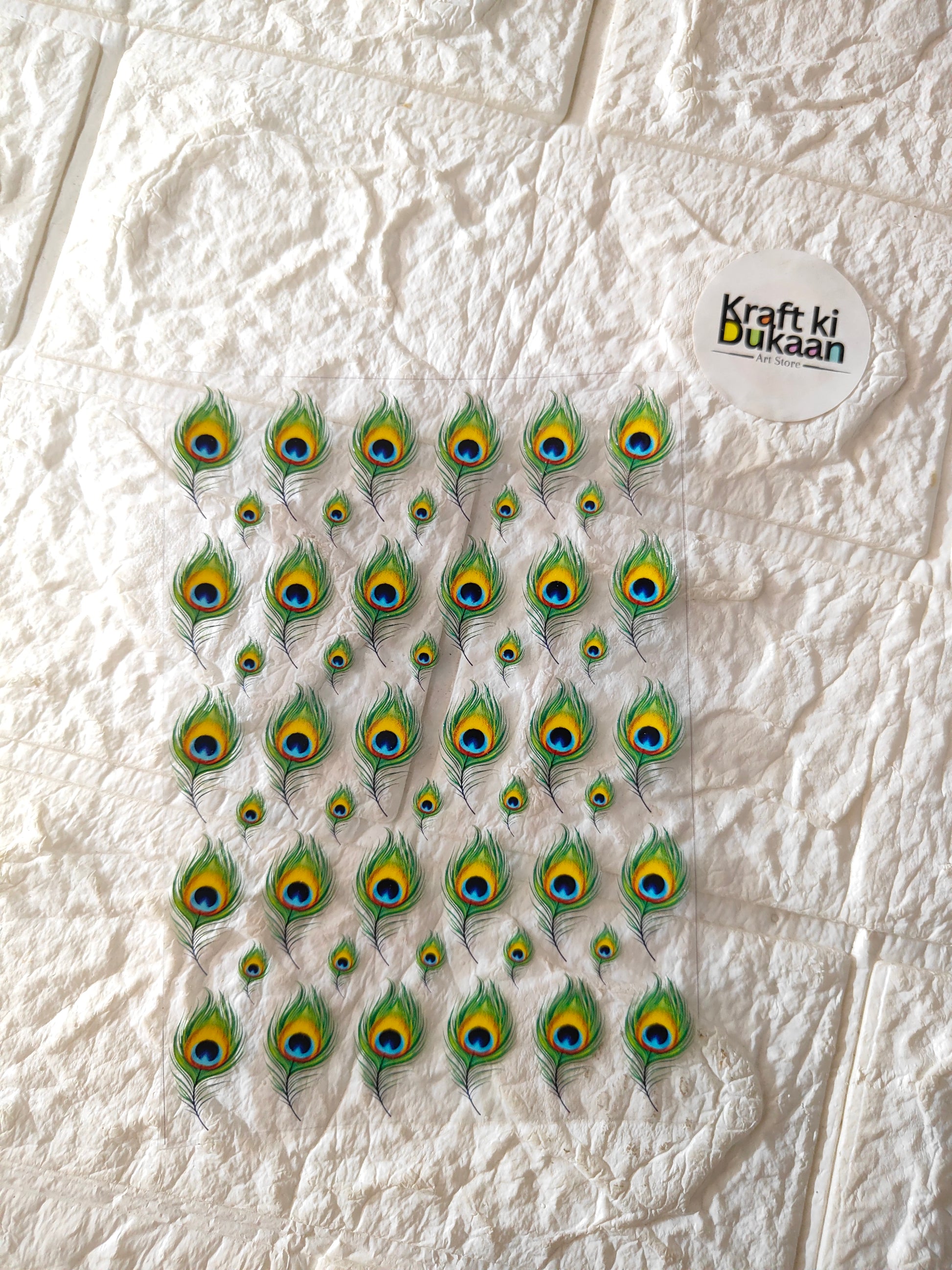 UV DTF peel-off sticker sheet with peacock-eye feather motifs (sheet of stickers).