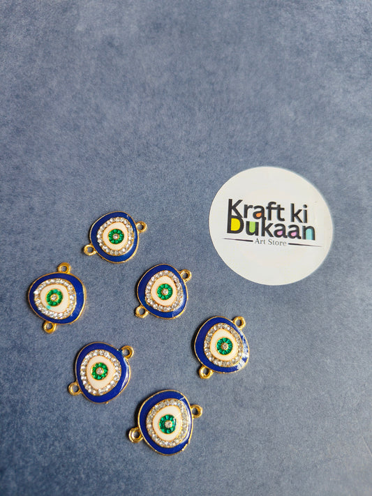 Circular rakhi pendants, blue enamel rings, green centers, gold-tone loops