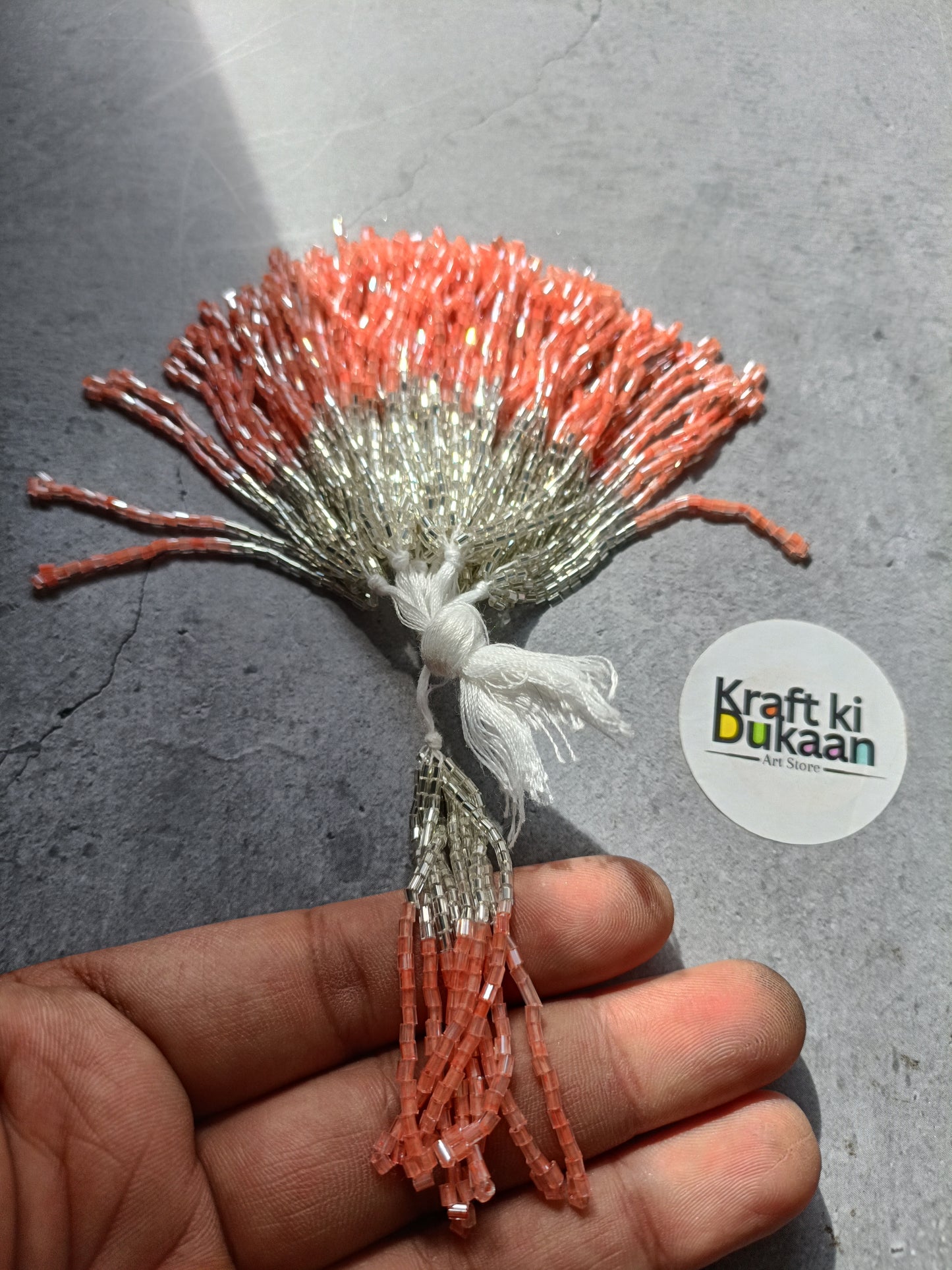 Orange and silver tinsel latkan strands bundle with metallic silver highlights