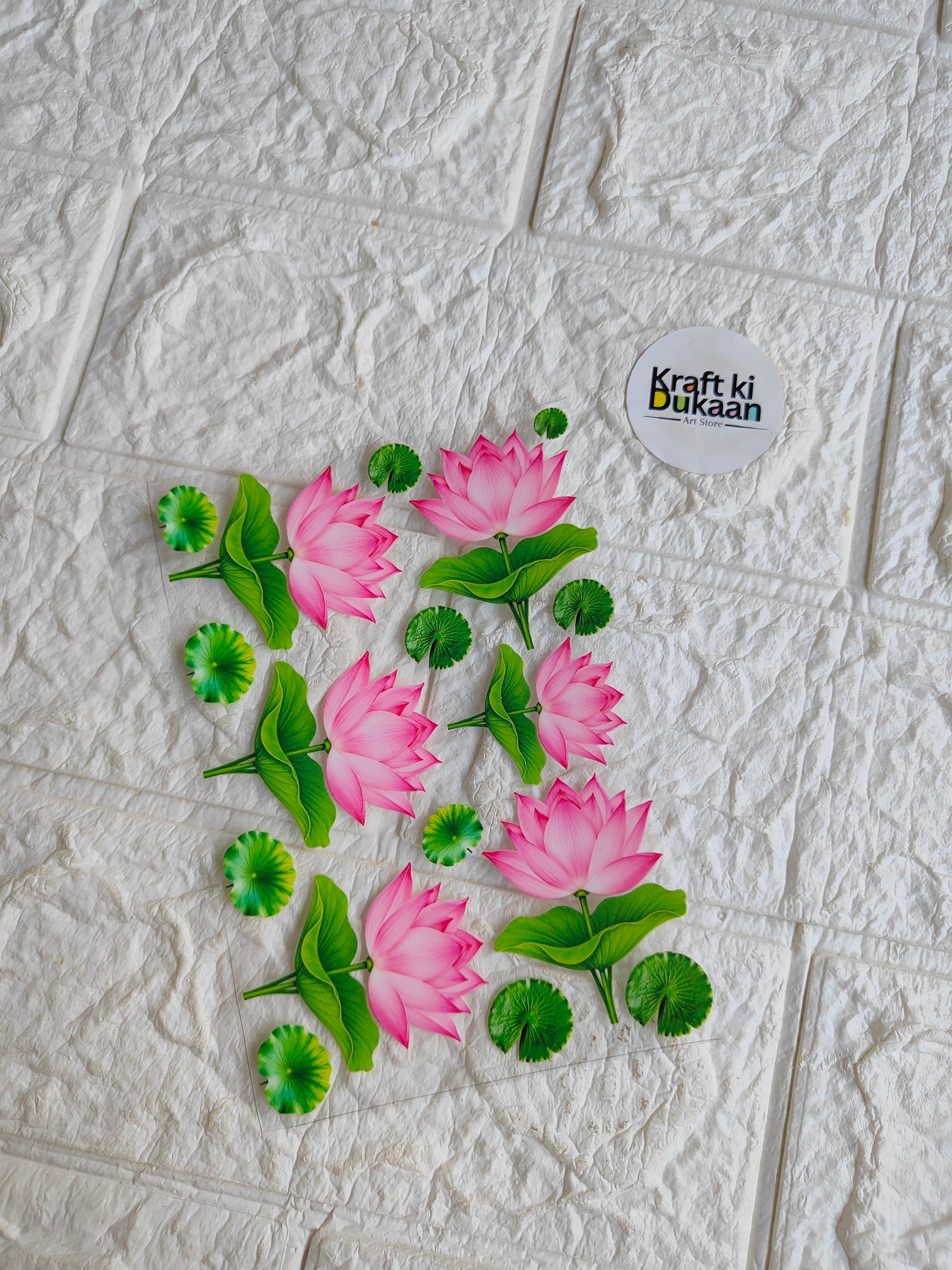 Peel-off sticker sheet with pink lotus flower design and green leaves