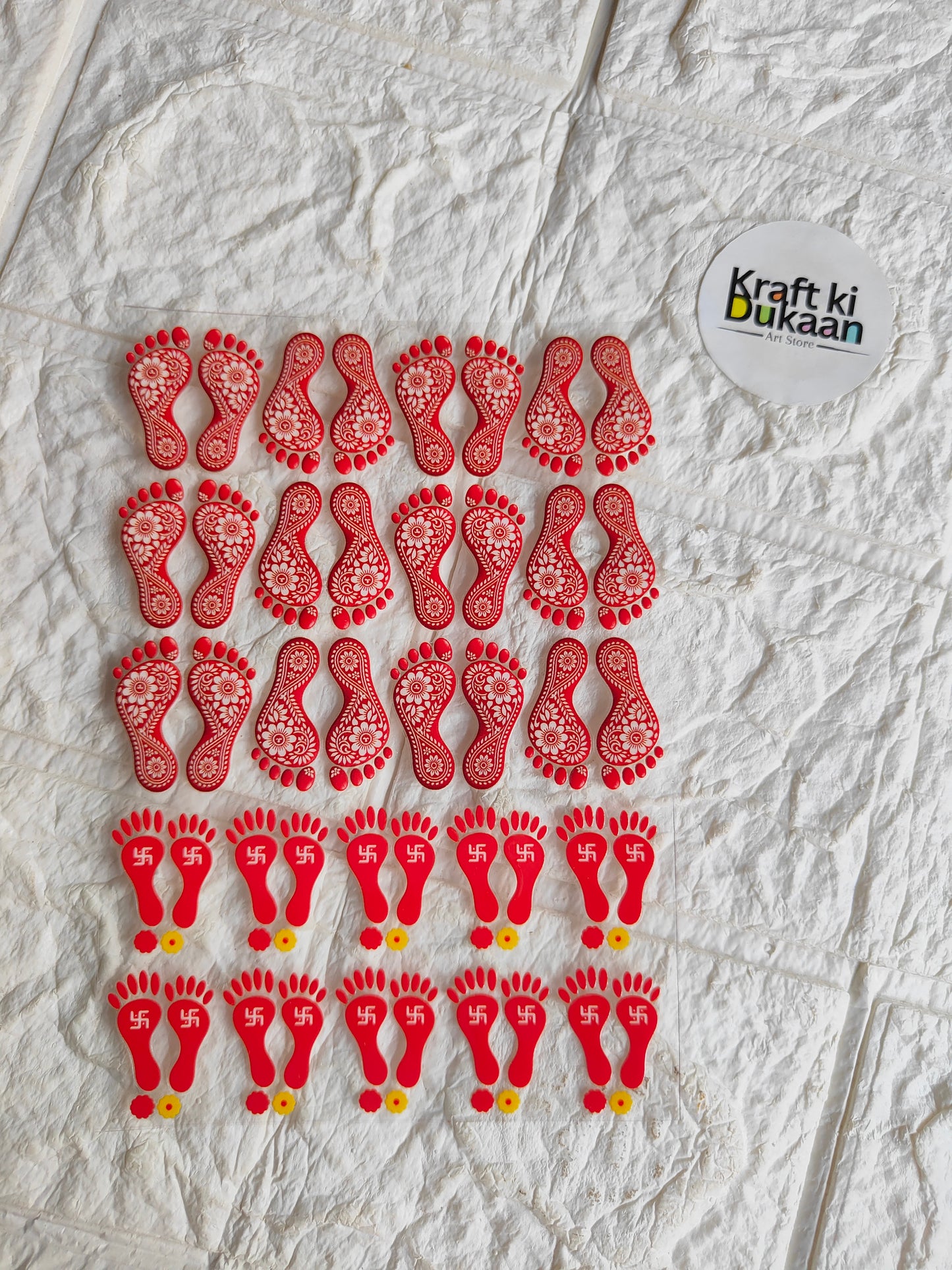 Peel-off sticker sheet with red rhinestone baby footprints in rows