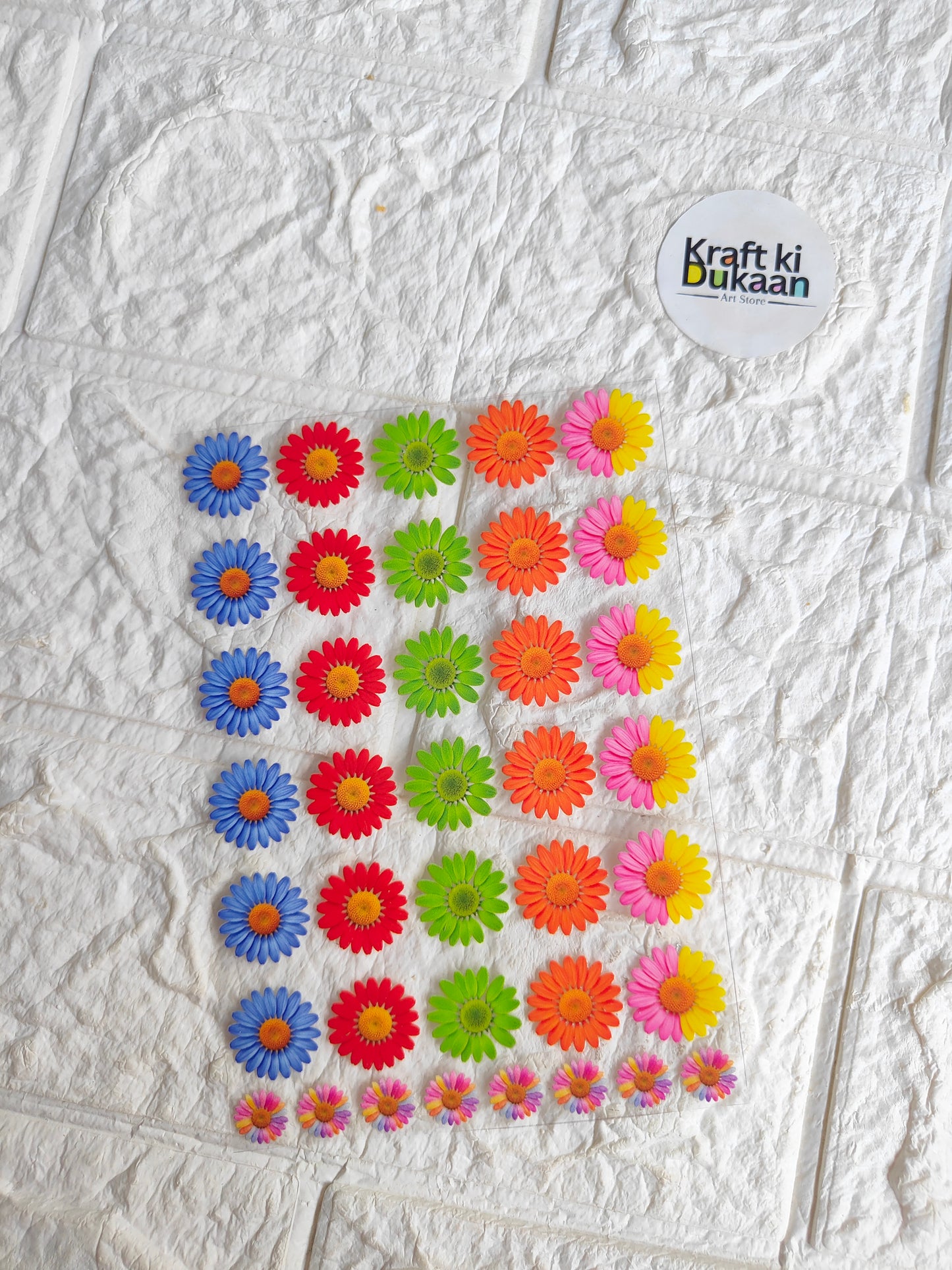 UV DTF peel-off sticker sheet with multicolor daisy-like flower decals