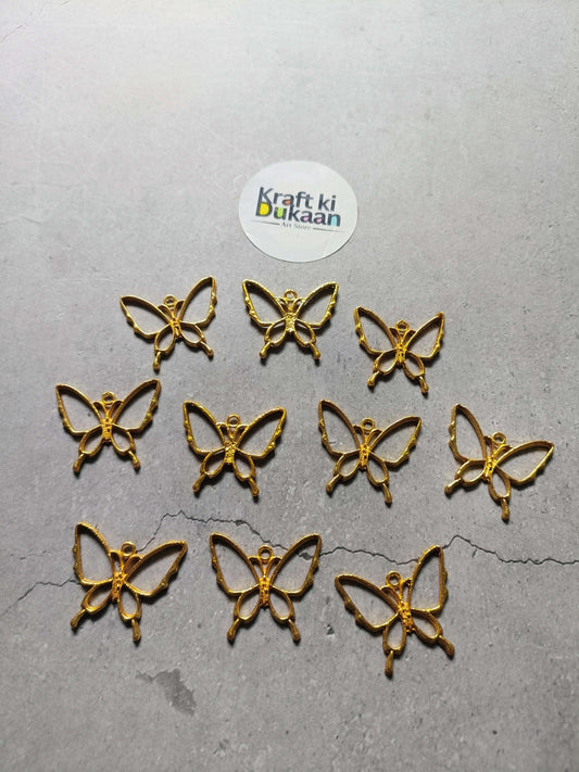 10 gold-tone butterfly bezel pendants, rhinestone details, small charm set.