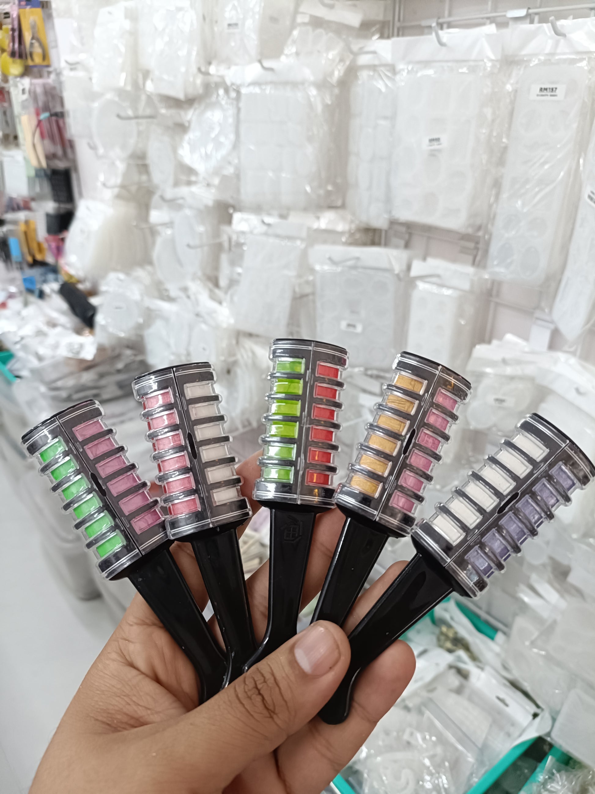 Hair color applicator comb set with black handles and multi-color dye reservoirs