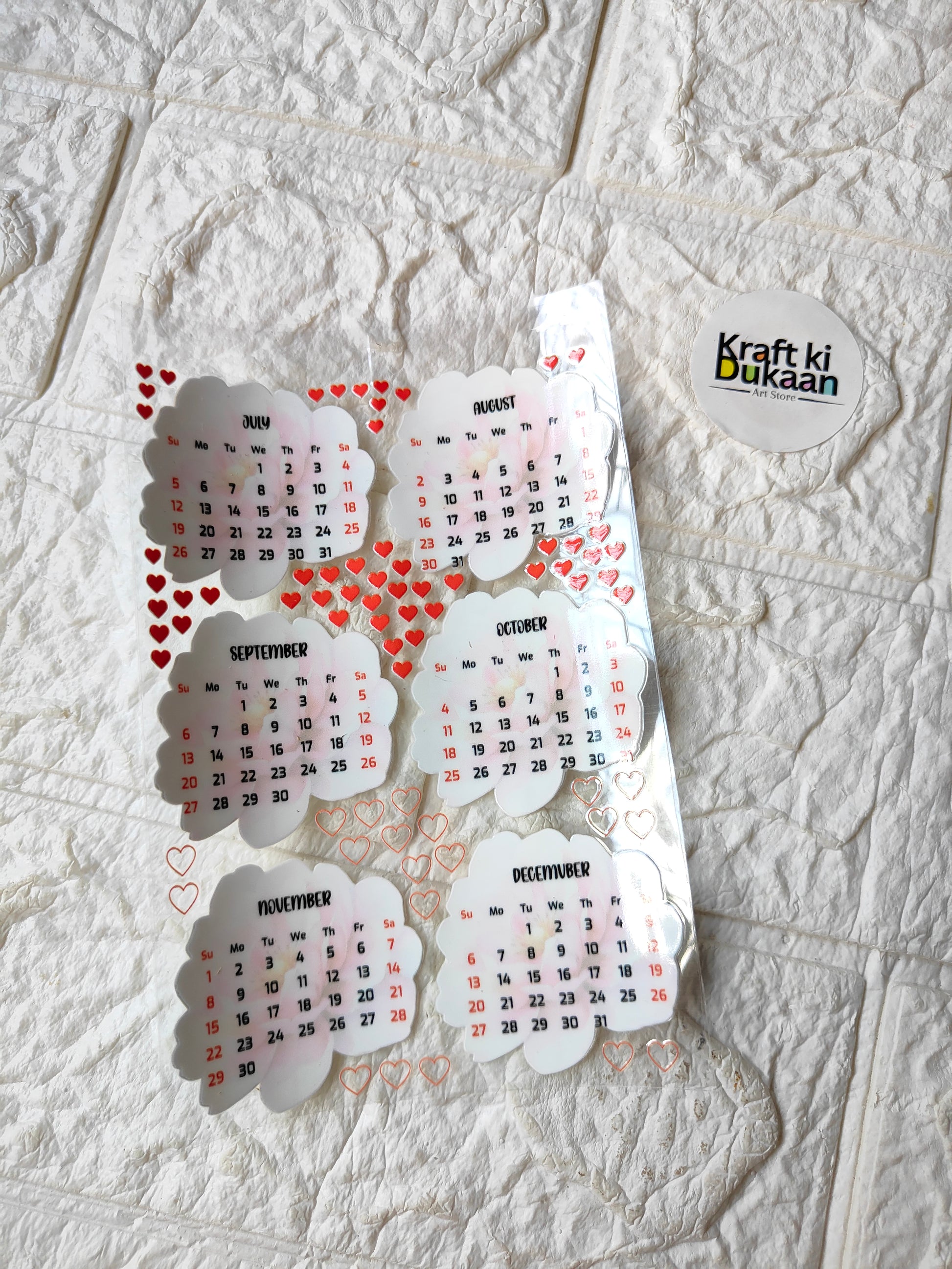 UV DTF peel-off sticker sheet with heart-themed calendar date stickers, multiple designs