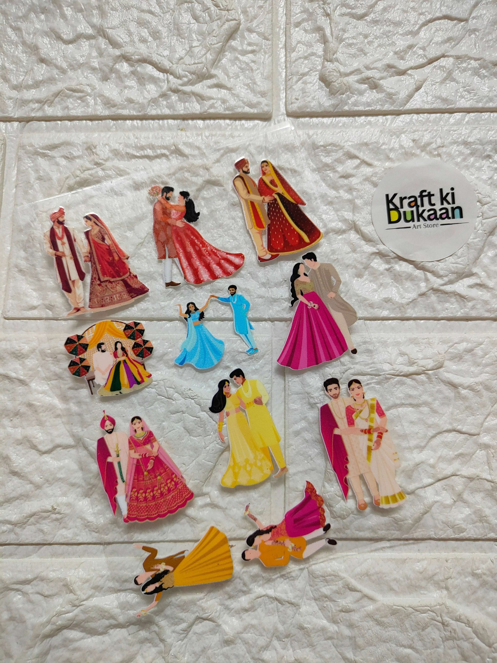 Peel-off sticker sheet with colorful illustrated figures in dresses, Kraft Ki Dukaan logo