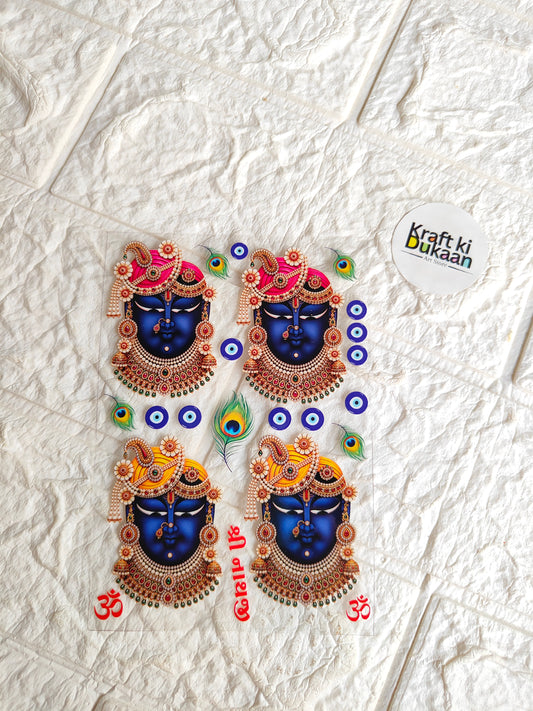 Peel-off sticker sheet with four colorful circular deity designs and peacock accents