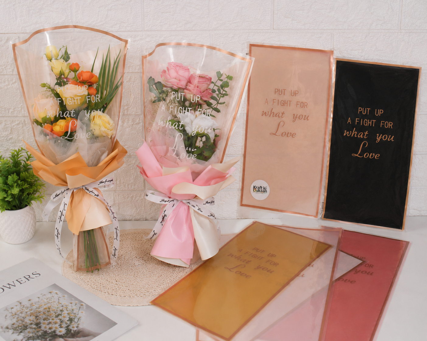 Assorted bouquet cover sleeves in beige, pink, and dark with orange trim and “Love” text