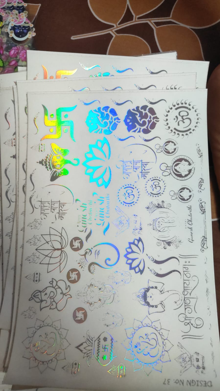 Holographic sticker sheet with blue and green animal and flower designs