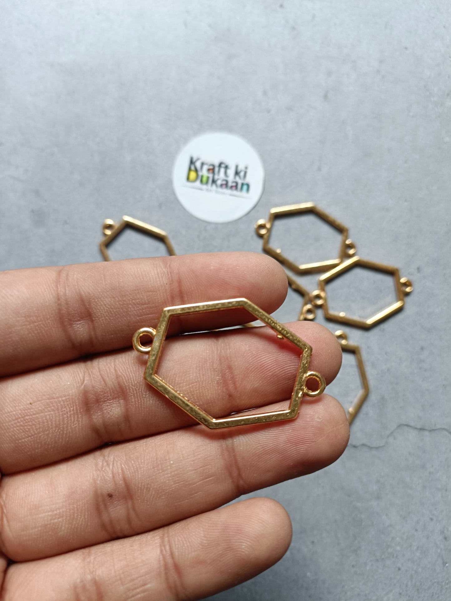 Hexagon bezel bracelet connector frame in hand, plain gold tone metal, single piece