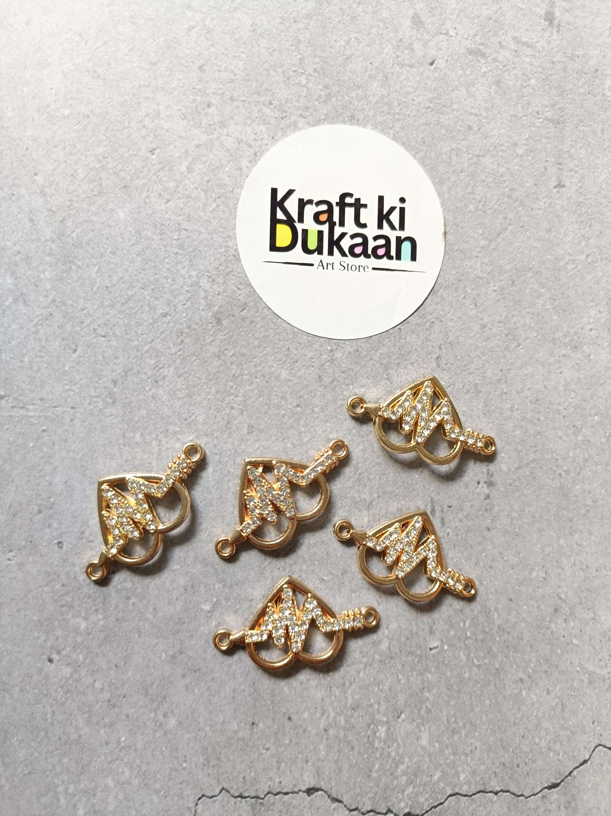 Gold-tone heart-shaped bracelet charms with rhinestone sparkle, 5 charms on display