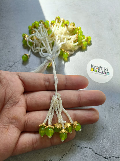 Green bead tassel latkan with white thread and gold accents