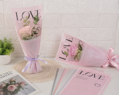 Assorted LOVE flower covers, including pink and beige, with heart and ribbon details