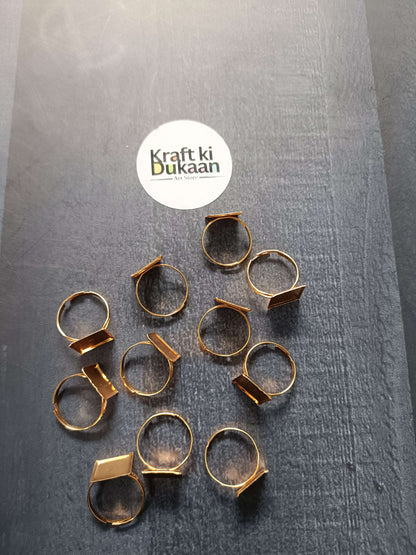 Gold-tone ring bases scattered: octagon and rectangle bezel open bands