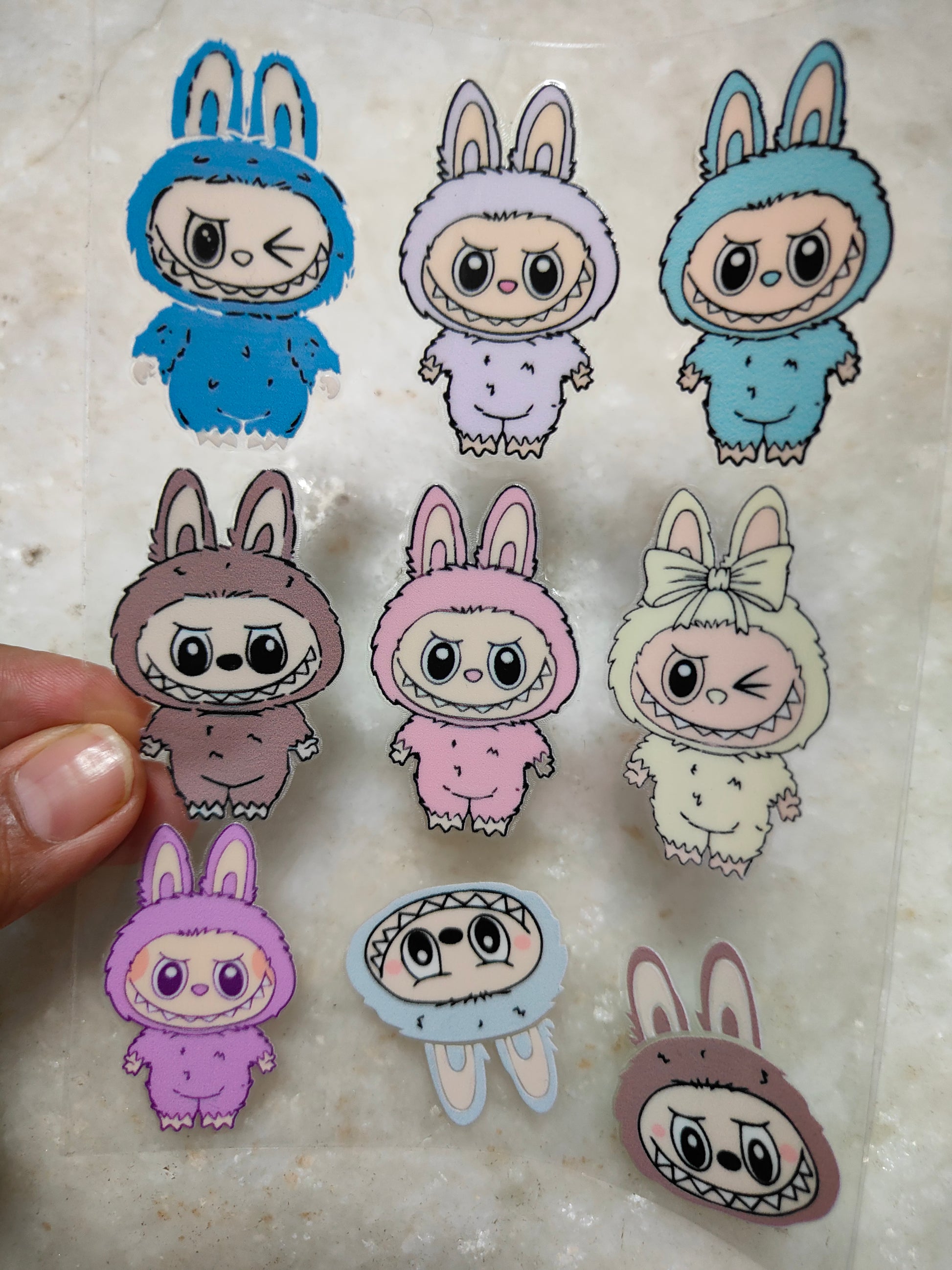 Peel-off sticker sheet with cute bunny and cat character designs