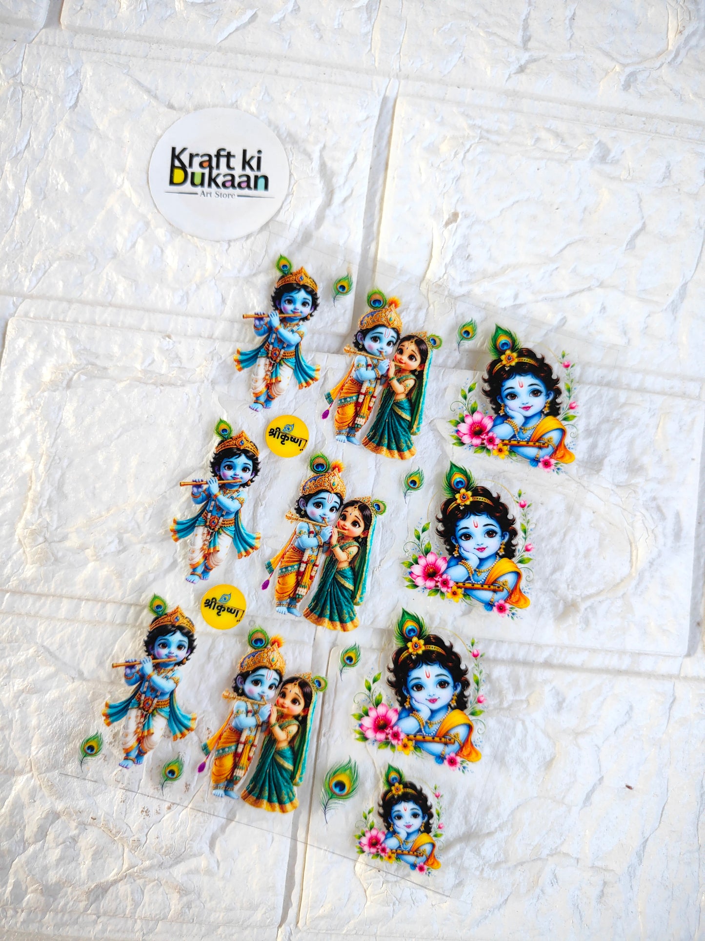UV DTF peel-off sticker sheet with colorful cartoon deity figures and peacock feather accents