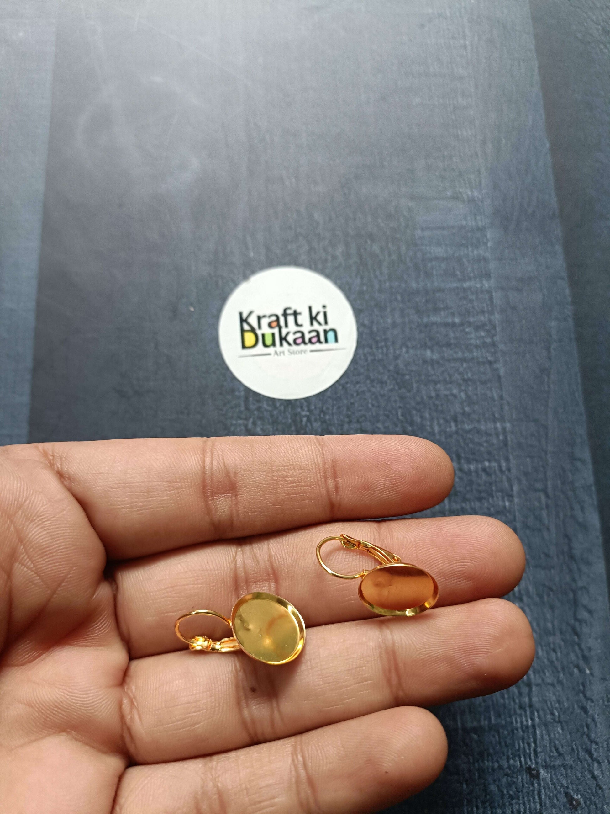 Round earring base pack of 2 in golden tone with pinkish circular inserts